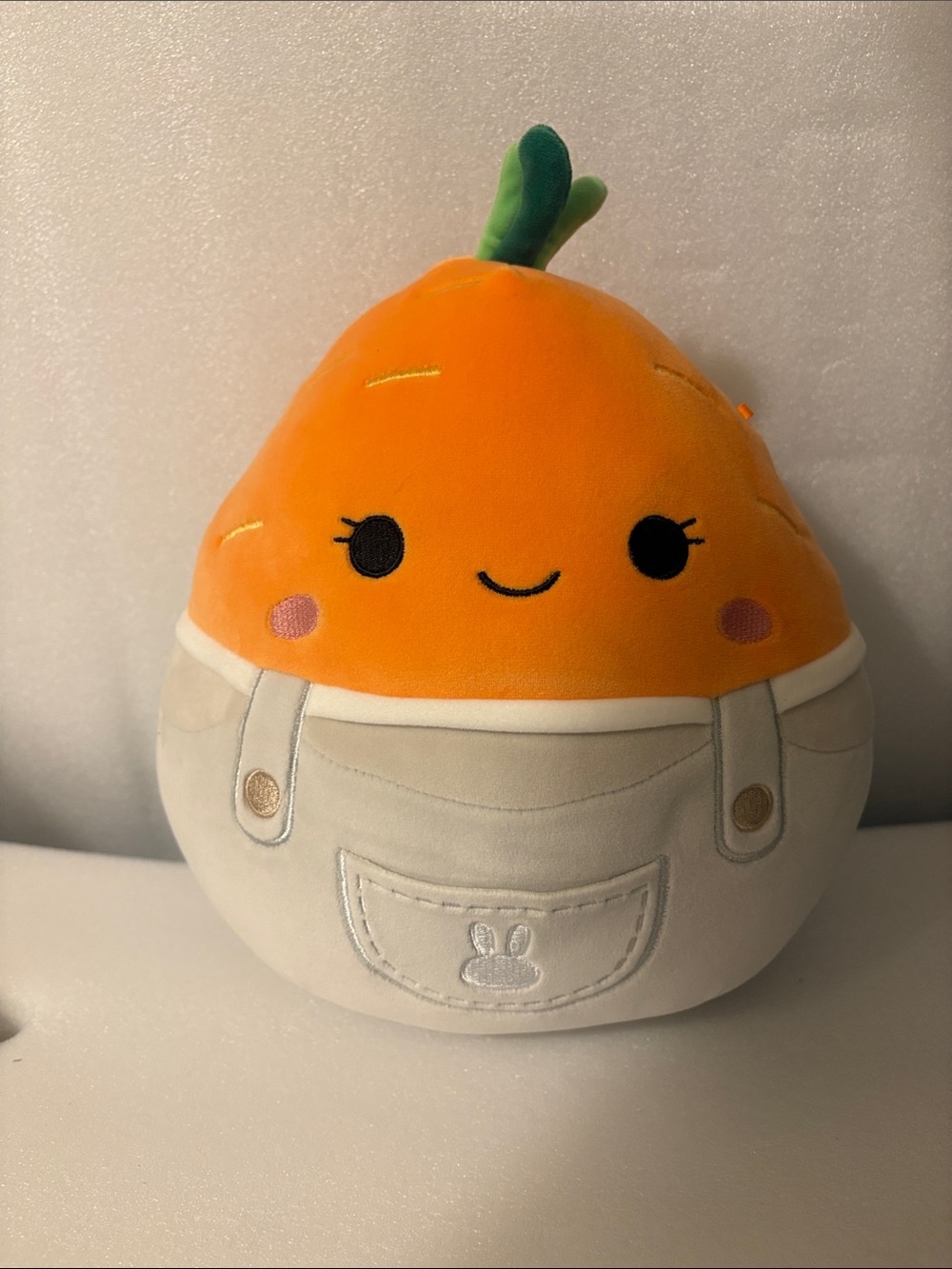 Squishmallows Orange Fruit Plush with Cream Overalls and Green Leaf